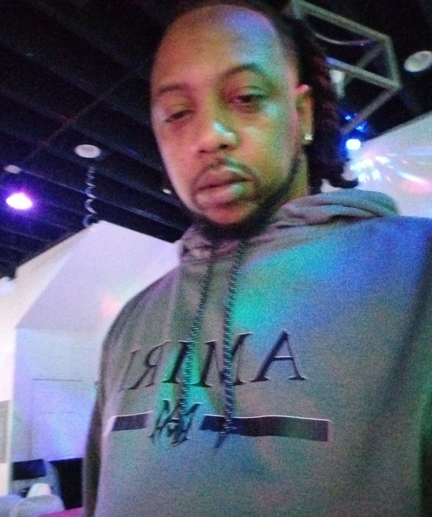 E Jilla Beats in a studio or event space under colored light