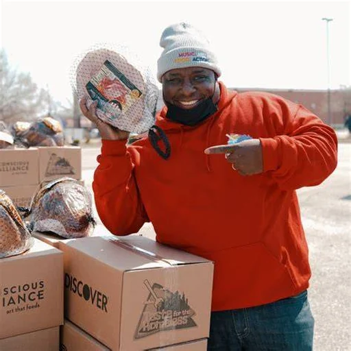 Michael Airhart with donated goods for community outreach