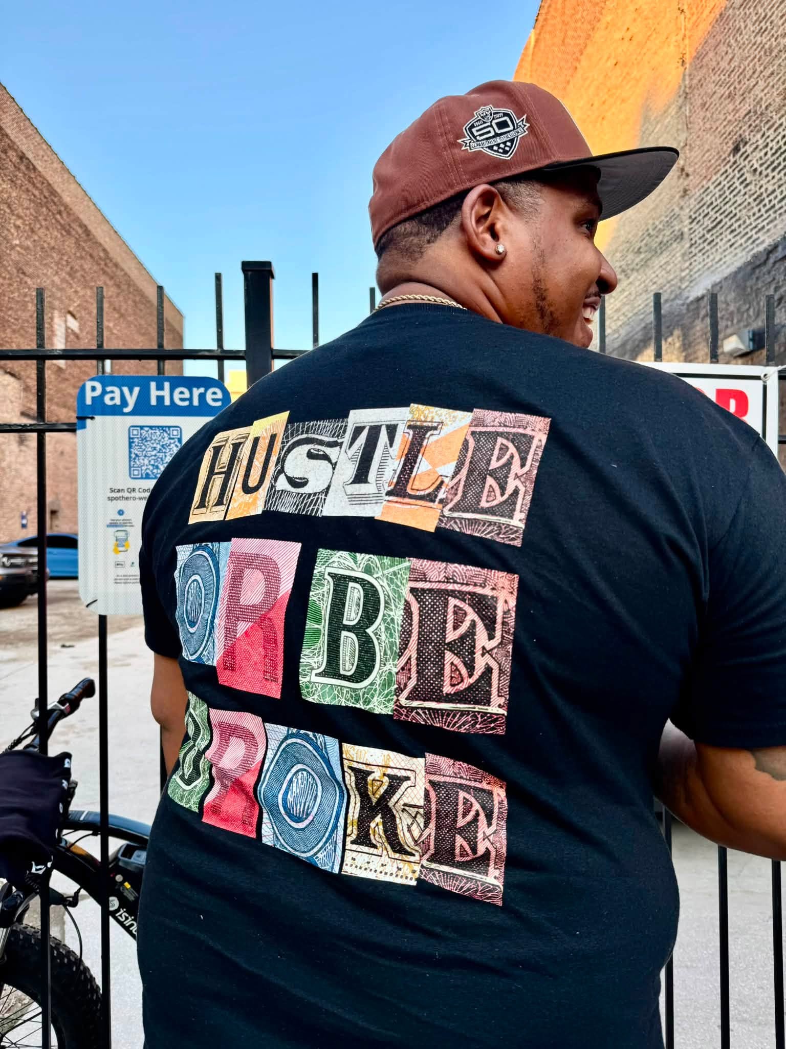 Sinatris wearing a Hustle Or Be Broke shirt in Chicago