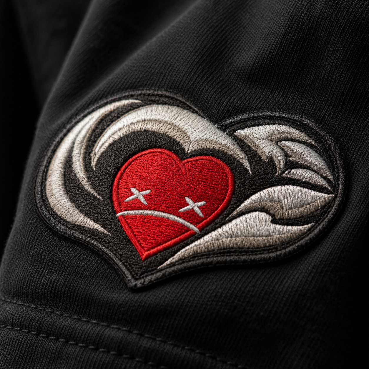 Close-up embroidered H.O.M.S. sleeve patch