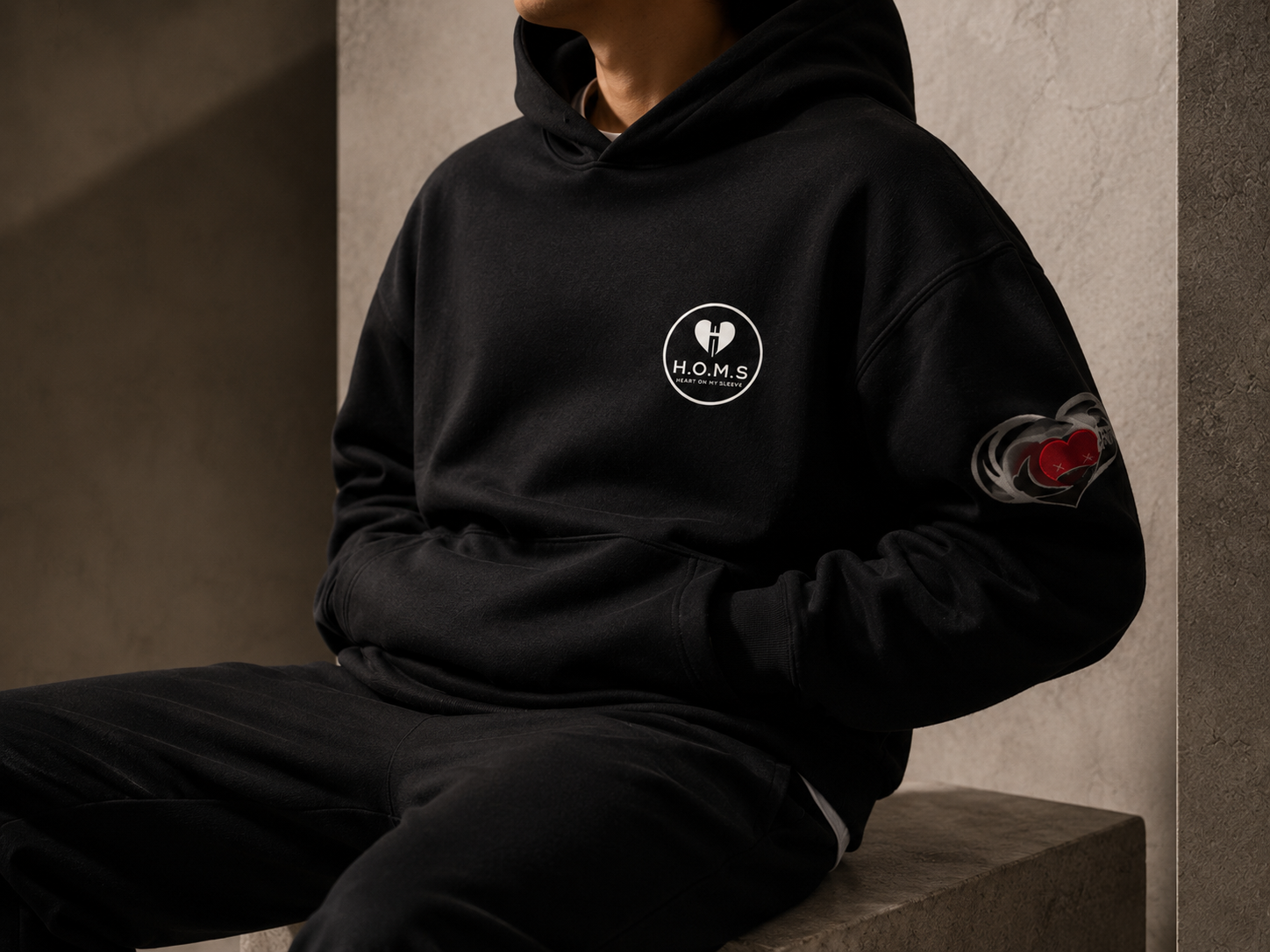 Model wearing H.O.M.S. hoodie and sweatpants